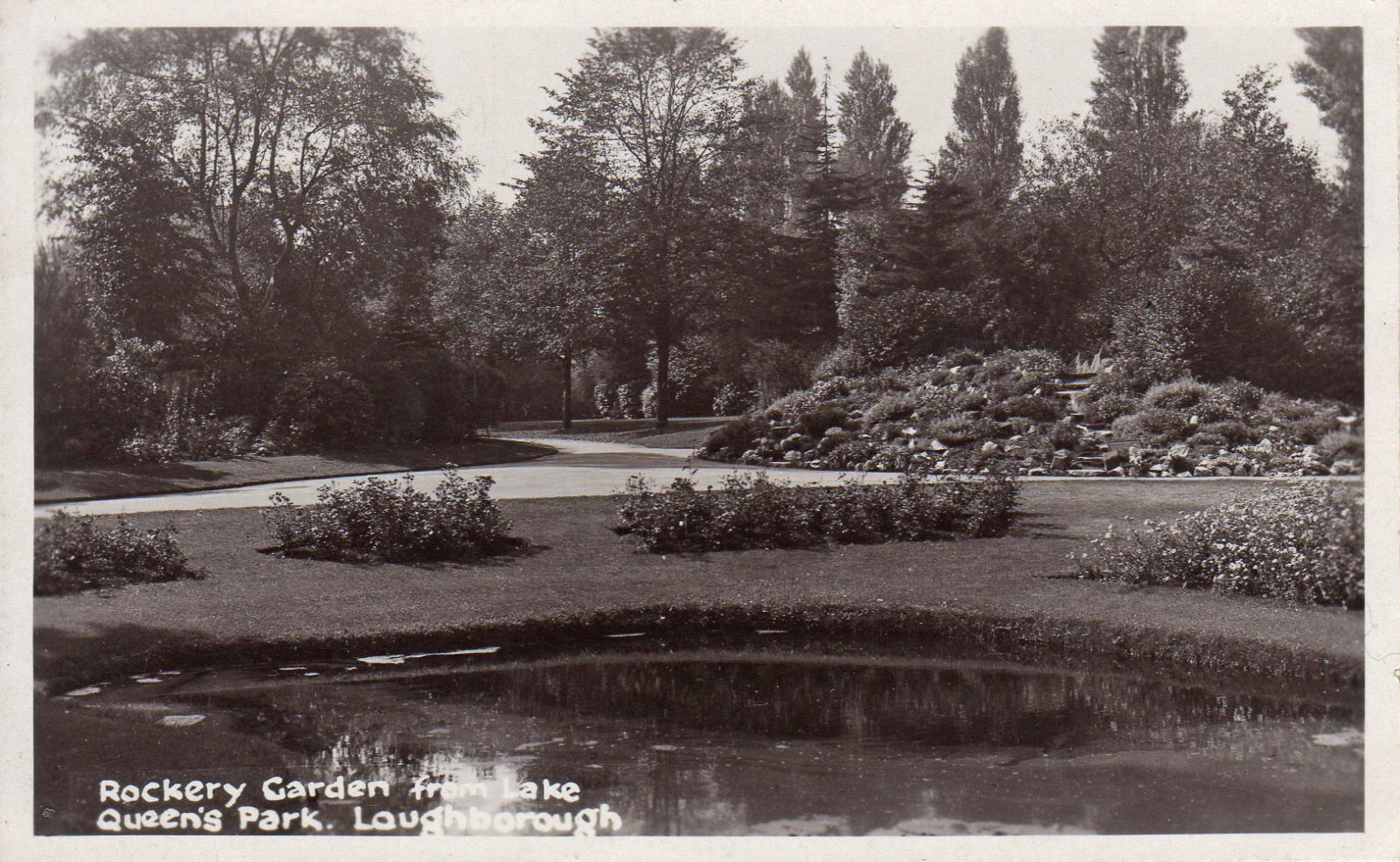 Queens Park, Loughborough. 1941-1960: Rockery Garden from the lake. Posted 1942 (File:1567)